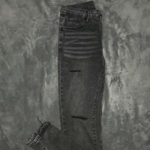 slightly black ripped jeans